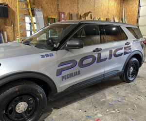 peculiar, mo police car